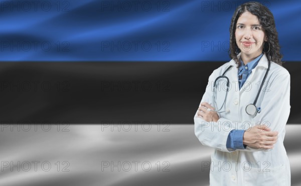 Estonian medicine and healthcare concept. Close up of doctor against Estonia flag background