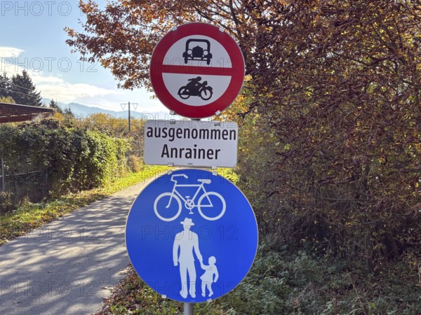Road signs along an autumn trail that is accessible to cyclists and pedestrians, bicycle tourism, Drau cycle path, Tyrol, Austria