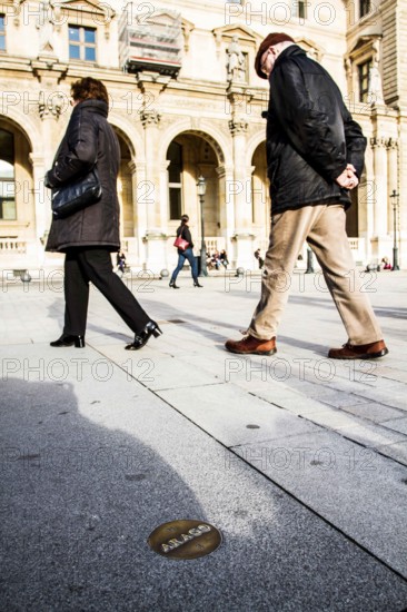 One of the Arago medallions at Louvre Museum (Musee du Louvre) defining the Rose Line, a fictional name given to the Paris Meridian and to the sunlight line defining the exact time of Easter on the Gnomon of Saint-Sulpice, marked by a brass strip on the floor of the church in the Priory of Sion mythology, where the two are conflated. Paris, France. 01.01.13