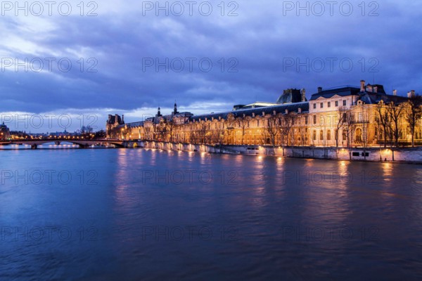 Seine River and Louvre Palace (Palais du Louvre) viewed from Pont des Arts at evening. Paris, France. 30.12.12