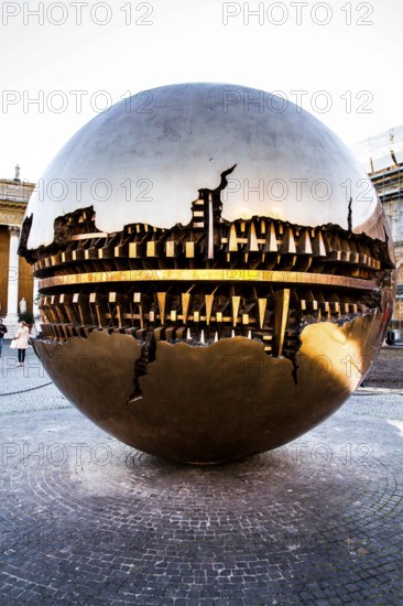 Sphere within Sphere (Esfera con Esfera), sculpture made by Arnaldo Pomodoro at Belvedere Courtyard (Cortile del Belvedere), in Vatican Museum. Vatican City, Vatican City State. 28.12.2012