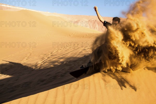 Sandboarding in Cerro Dragon, in Atacama Desert. Iquique, Tarapaca Region, Chile. 17.11.15