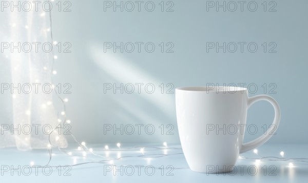 A white coffee cup sits on a table next to a string of lights. The lights are twinkling and creating a warm, cozy atmosphere. The cup is the focal point of the image. AI generated