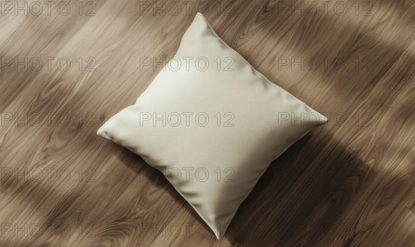 A cream pillow on a hardwood floor with natural light and shadows. AI generated