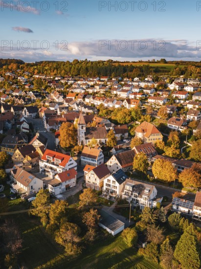 A village full of colorful roofs and autumnal opulence under blue skies, Deufringen, Aidlingen, Böblingen district, Germany