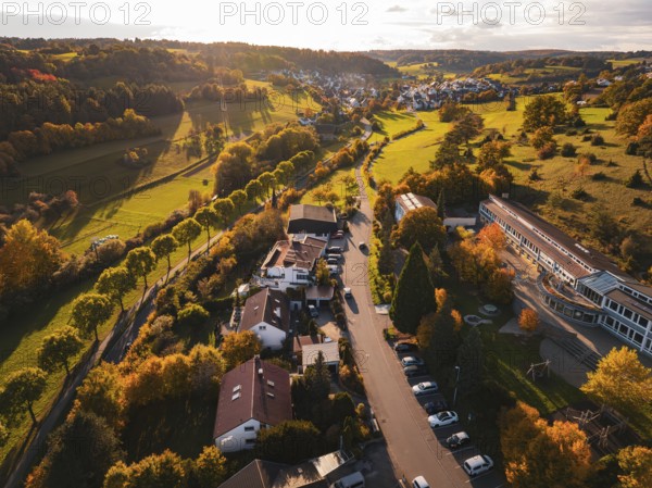 An autumnal village with fields and trees, sunbeams across the countryside, Deufringen, Aidlingen, Böblingen district, Germany