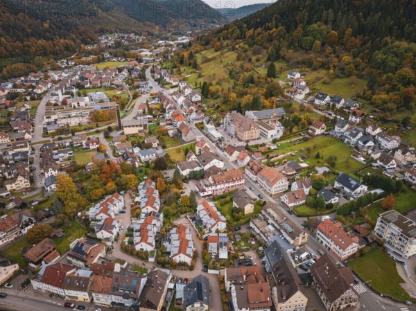 Panorama of a village view surrounded by hills in autumn colors and natural surroundings, Calmbach, Bad Wildbad, Black Forest, Germany