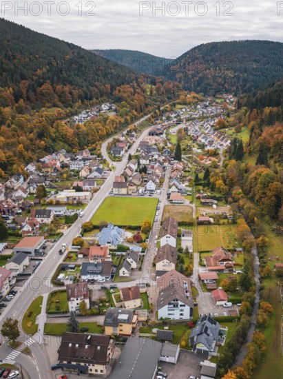 Aerial view of an elongated valley with autumnal foliage and urban development, Calmbach, Bad Wildbad, Black Forest, Germany