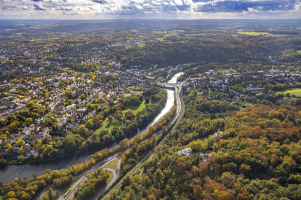Aerial view, Brehminsel with Heyerstrang, below Villa Vue Restaurant in Herbstwald, Ruhr River and Werden district with Gustav Heinemann Bridge, Bredeneyer Straße B224 and railway tracks, below the White Mill at the Neukirchen lock, view of the Heidhausen district, trees in autumn colors, Bredeney, Essen, Ruhr area, North Rhine-Westphalia, Germany, colorful trees, DE, Essen-Süd, Europe, autumn colors, autumn mood, autumn forest colors, cornmill, aerial view, aerial photography, aerial photography, Neukircher Mühle, overview, bird's eye view, forest in autumn colors, birds-eyes view, colorful autumn leaves, autumnal forest, overview, round bay window