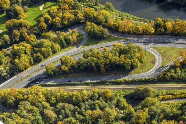 Aerial view, bridge and driveway Bredeneyer Straße, federal road B224 on the river Ruhr, railway tracks and trees in autumn colors, Bredeney, Essen, Ruhr area, North Rhine-Westphalia, Germany, DE, Essen-Süd, Europe, aerial photography, overview, birds-eyes view, overview