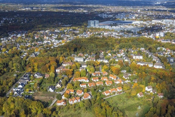 Aerial view, Krupp Siedlung Brandenbusch residential area with red roofs, Diakoniewerk Essen Ev. including day care center and family center Am Brandenbusch, Essen-Bredeney church, in the back the Gruga exhibition center, Bredeney, Essen, Ruhr area, North Rhine-Westphalia, Germany, DE, Essen-Süd, Europe, property tax, real estate, aerial photography, aerial photography, overview, bird perspective, residential complex, housing and living, residential area, quality of living, residential district, residential area, birds-eyes view, overview
