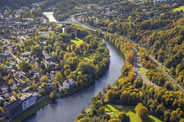Aerial view, river Ruhr and Brehminsel with Heyerstrang, district of Werden with Gustav Heinemann bridge, Bredeneyer Straße B224 and railway tracks, below the White Mill at the Neukirchen lock and Villa Werden, apartment buildings residential buildings on the Hardenbergufer, old factory building of the former Gebrüder Feulgen cloth factory with monument protection, trees in autumn colors, Bredeney, Essen, Ruhr area, North Rhine-Westphalia, Germany, railroad tracks, DE, Essen-Süd, Europe, real estate, Kornmühle, aerial view, aerial photography, aerial photography, Neukircher Mühle, overview, bird's eye view, residential complex, housing and living, residential area, quality of living, residential district, residential district, birds-eyes view, overview