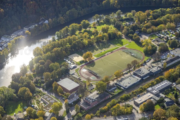 Aerial view, sports hall and sports field Löwental Werden, soccer stadium and athletics stadium, river Ruhr and autumn trees, Werden, Essen, Ruhr area, North Rhine-Westphalia, Germany, colorful trees, trees in autumn colors, DE, Essen-South, Europe, soccer field, soccer stadium, autumn colors, autumn colors, autumn mood, autumn forest colors, aerial photography, aerial photography, sports, sports facilities, sports field, overview, bird's eye view, forest in autumn colors, birds-eyes view, colorful autumn leaves, autumn forest, overview