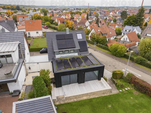 Aerial view of a house with solar system in a quiet residential area, house renovation, climate renovation, Metzingen, Germany