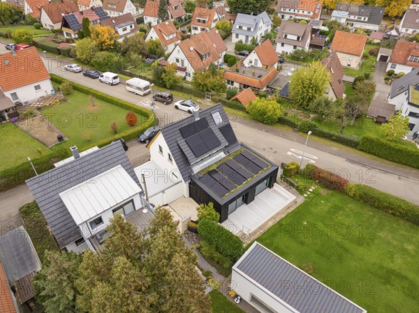 View from above of the garden side with covered terrace, PV system and spacious green area, house renovation, air-conditioning renovation, Metzingen, Germany