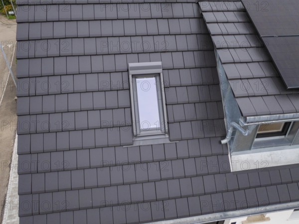 Detailed view of a roof with skylight near the gutter, house renovation, climate renovation, Metzingen, Germany
