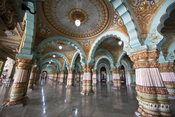 Granite columns with ornate arches and stucco ceilings, Durbar Hall in Mysuru Palace or Amba Vilas Palace, interior view, Mysore or Mysore, Karnataka, India