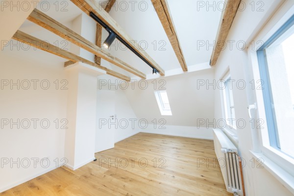 Renovated attic room with beams, skylights and bright, friendly atmosphere, house renovation, climate renovation, Metzingen, Germany
