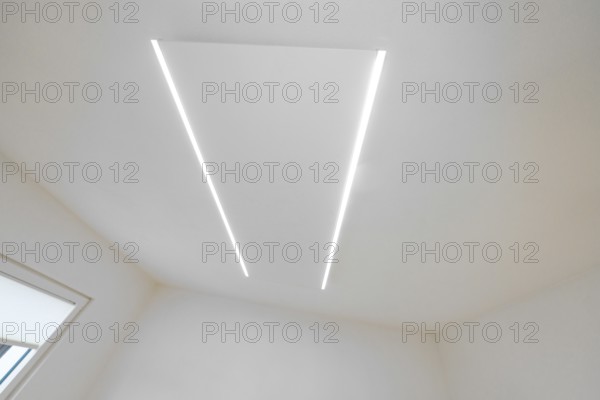Bright ceiling with two parallel LED light strips, minimalistic design, house renovation, climate renovation, Metzingen, Germany