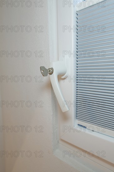Detail of a white window handle with integrated blind, clean and modern, house renovation, climate renovation, Metzingen, Germany