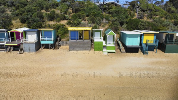 A row of beach houses on a sunny day on an Australian beach, seen from above