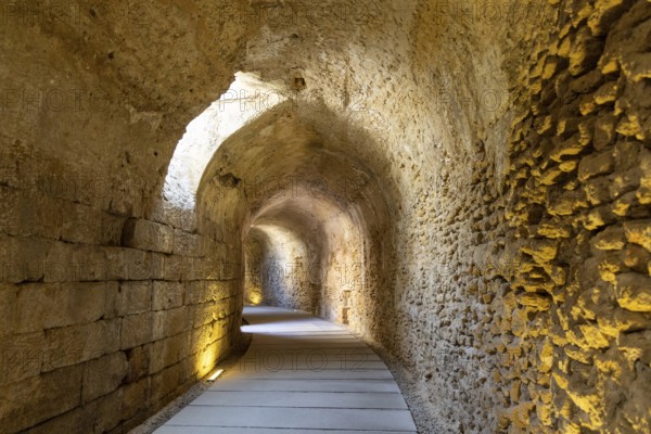 An old historic theatre in the middle of a city. Access tunnel to seats. The ruin was uncovered, Teatro Romano de Cadiz, Andalusia, Spain
