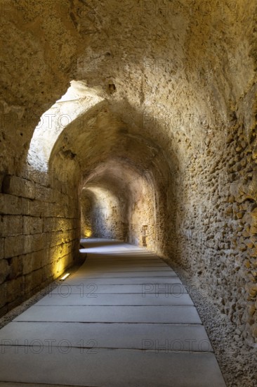 An old historic theatre in the middle of a city. Access tunnel to seats. The ruin was uncovered, Teatro Romano de Cadiz, Andalusia, Spain