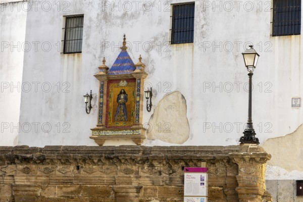 Street scene of a city, historic and Mediterranean. Nice old facades with balconies and narrow alleys and streets. Great view of the sunny Atlantic Ocean, Cadiz, Andlusia, Spain