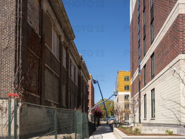 A large scale housing construction project including new mid-rise and high-rise buildings accompany existing buildings once used as part of the former Victoria Hospital on October 16, 2025 in London, Ontario, Canada