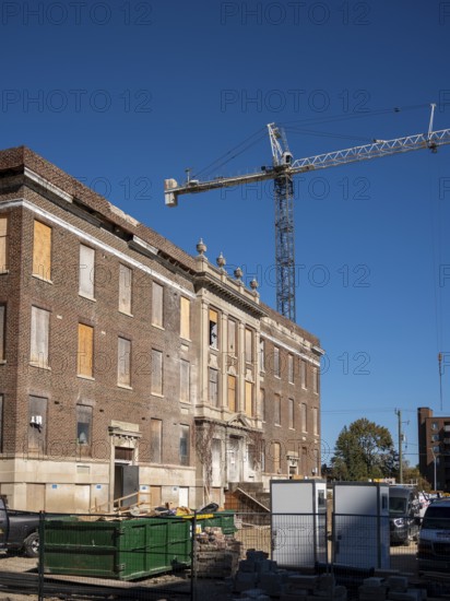 A large scale housing construction project including new mid-rise and high-rise buildings accompany existing buildings once used as part of the former Victoria Hospital on October 16, 2025 in London, Ontario, Canada