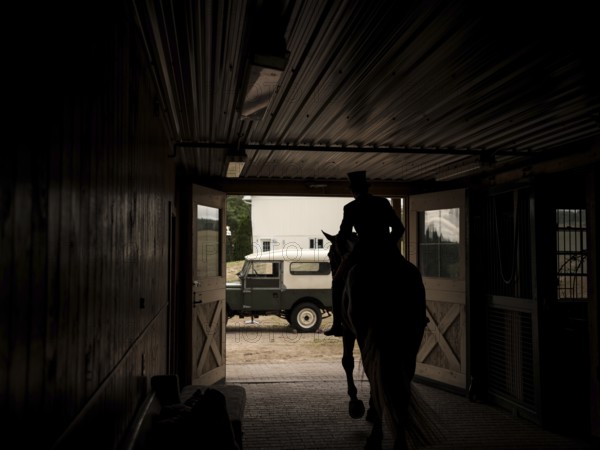A rider from the Toronto North York Hunt Club, dressed in traditional hunting clothes, prior to a club event on August 26, 2025, in Mulmer, Ontario, Canada