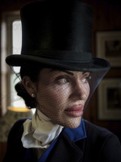 A rider from the Toronto North York Hunt Club, dressed in traditional hunting clothes, prior to a club event on August 26, 2025, in Mulmer, Ontario, Canada