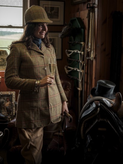 A rider from the Toronto North York Hunt Club, dressed in traditional hunting clothes, prepares ahead of a ride on August 26, 2025, in Mulmer, Ontario, Canada