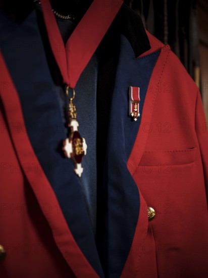 A riding jacked adorned with commemorative medals hang in the tack room at the Toronto North York Hunt Club on August 26, 2025 in Mulmer, Ontario, Canada
