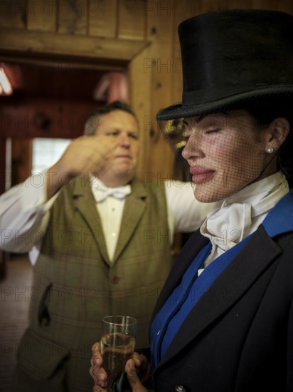 Members of the Toronto North York Hunt Club, dressed in traditional hunting clothes, prepare ahead of a ride on August 26, 2025, in Mulmer, Ontario, Canada