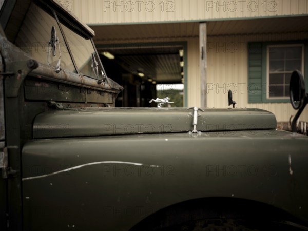 The front end of a 1950's Series One Land Rover, parked at the Toronto North York Hunt Club in Mulmer, Ontario, Canada