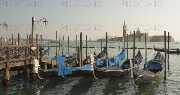 St. George monastery on St. George island and gondolas, Venice, Italy