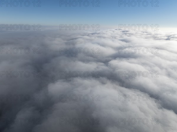 Aerial view, clouds of fog, fog cover seen from above, with clear blue sky, Germany