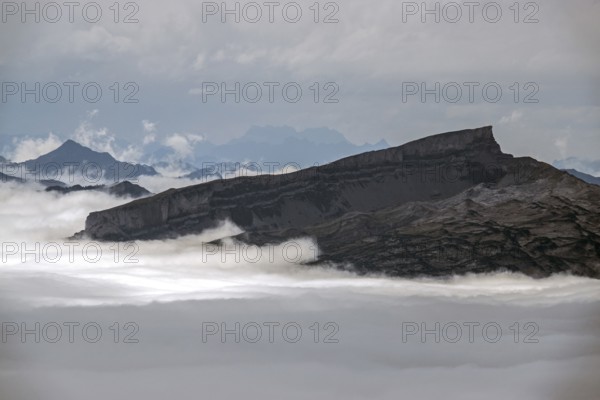 View from Nebelhorn summit on Hoher Ifen, mountains rising from fog in the valley, Oberstdorf, Oberallgäu, Allgäu, Bavaria, Germany