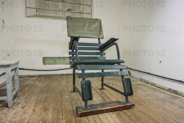 Chair, cellar, exhibition, former KGB headquarters with prison, Pagari 1, Old Town, Tallinn, Estonia
