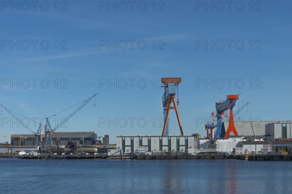 Shipyards with docks in Kiel port, equipped submarine under construction, armament, Thyssen Krupp subsidiary TKMS Dock (left), stock exchange, cranes, Kiel Fjord, Schleswig-Holstein, Germany
