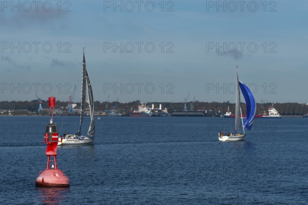 State capital Kiel, industry and shipyards in the Friedrichsort district, LINDENAU Werft GmbH, dock, cranes, sailboats, red buoy with solar panels, economy, industry, Schleswig-Holstein, Germany