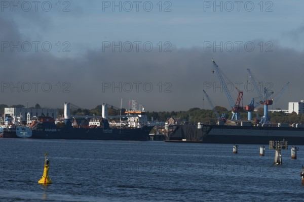 State capital Kiel, industry and shipyards in the Friedrichsort district, LINDENAU Werft GmbH, hall, cranes, economy, industry, yellow buoy with solar modules, restricted area, Schleswig-Holstein, Germany
