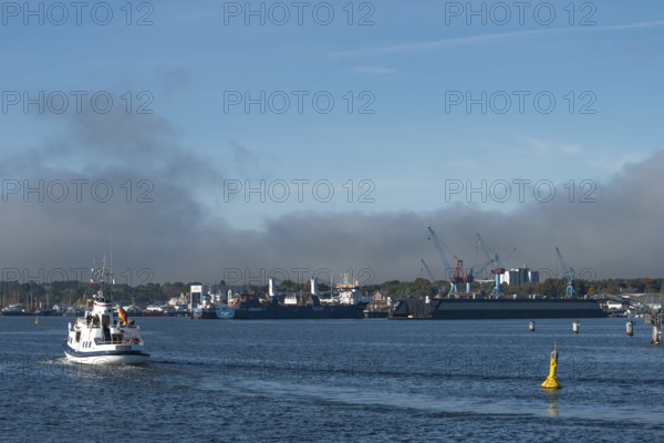State capital Kiel, industry and shipyards in the Friedrichsort district, LINDENAU Werft GmbH, dock, cranes, conveyor ship, economy, industry, yellow buoy with solar modules, restricted area, Schleswig-Holstein, Germany