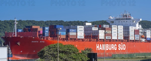 Container ship from the shipping company Hamburg Süd Santa Rita with container leaving Container ship from the shipping company Hamburg Süd Santa Rita with container when leaving
