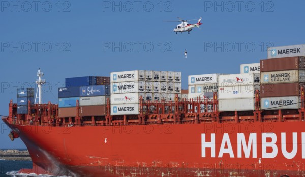 Container ship from the shipping company Hamburg Süd Santa Rita with container and helicopter to release a port pilot leaving the Indian Ocean South Africa Container ship from the shipping company Hamburg Süd Santa Rita with container and helicopter to lower a harbor pilot when leaving the Indian Ocean South Africa
