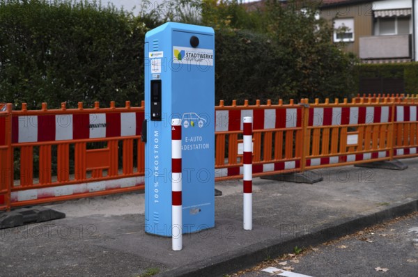 Parking lot with gas pump, EnBW charging station for electric cars, charging station, e-mobility, empty, free, unused, without e-car, pictogram, logo, construction site behind it, Stuttgart, Baden-Württemberg, Germany