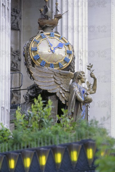 Angel figure with big clock at the upscale department store Selfridge, Oxford Street, London, England, Great Britain