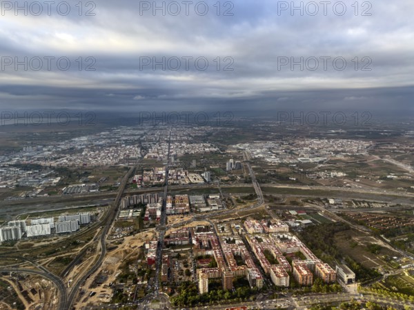 Fonteta district, Turia flood canal and road bridges behind, aerial view, Valencia, Spain
