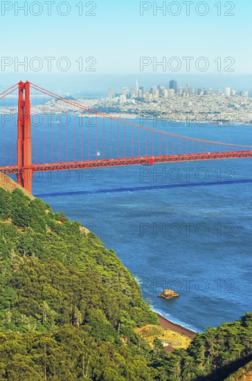 View of Golden Gate Bridge and financial district in the distance, San Francisco, California, USA
